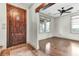 Entryway with hardwood floors, natural lighting, a decorative rug, and a wood door leading to another room at 4162 Club Course Dr, North Charleston, SC 29420