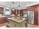 Spacious kitchen featuring a large island with a sink, stainless steel appliances, and custom cabinets at 4162 Club Course Dr, North Charleston, SC 29420