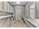 Bright laundry room featuring granite counters and abundant storage at 4162 Club Course Dr, North Charleston, SC 29420