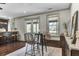 Open floorplan featuring bar seating, hardwood floors, and many windows with natural light at 4162 Club Course Dr, North Charleston, SC 29420