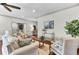 Cozy living room featuring hardwood floors, white sofas, an ornate coffee table, and decorative pillows at 4162 Club Course Dr, North Charleston, SC 29420