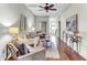 Tastefully decorated living room features hardwood floors, modern lighting, and comfortable seating at 4162 Club Course Dr, North Charleston, SC 29420