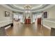 Spacious lobby featuring elegant wood floors, a decorative dresser, and access to multiple rooms at 4162 Club Course Dr, North Charleston, SC 29420