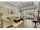 Comfortable lounge area with plush seating, wood floors, decorative accents, and access to the outdoors at 4162 Club Course Dr, North Charleston, SC 29420