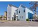 The light blue two-story home has a garage and back patio at 4416 Louisa Ln, North Charleston, SC 29405