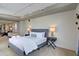 This bedroom features carpet, a queen bed with stylish blue nightstands, and direct access to the living area at 487 King St # 201, Charleston, SC 29403