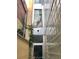 Exterior view of building featuring a narrow alleyway with a glass block window wall and a door at 487 King St # 201, Charleston, SC 29403