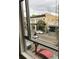 Exterior buildings seen through a window; a blend of urban life visible from inside at 487 King St # 201, Charleston, SC 29403