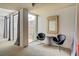 Bright sitting area featuring two sleek black chairs near a window, and modern decor at 487 King St # 201, Charleston, SC 29403