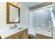 Bright bathroom with modern vanity, framed mirror, and a shower-tub combo, providing a functional and stylish space at 501 Hedge Way, Summerville, SC 29486