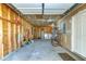 Image of an empty garage with a washing machine, water heater and some storage shelves at 501 Hedge Way, Summerville, SC 29486