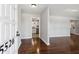 Bright entryway featuring hardwood floors, light gray walls, and open access to the kitchen at 5520 Gale St, North Charleston, SC 29406