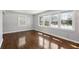 Sunlit living room with hardwood floors, neutral walls, and ample windows offering great views at 5520 Gale St, North Charleston, SC 29406