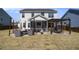 Wide shot of backyard featuring a covered patio, outdoor seating, pergola, and lush lawn at 624 Sienna Way, Summerville, SC 29486