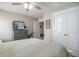 Bedroom features a queen bed, dresser and double closets, along with neutral walls at 624 Sienna Way, Summerville, SC 29486