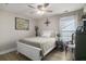 Comfortable bedroom with a queen bed, ceiling fan, and a large window for natural light at 624 Sienna Way, Summerville, SC 29486