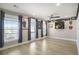 Open bonus room featuring light wood floors, ceiling fan, and multiple windows for ample natural light at 624 Sienna Way, Summerville, SC 29486