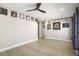 Spacious bonus room with wood floors, ceiling fan, and wall art at 624 Sienna Way, Summerville, SC 29486