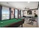 Bonus room with pool table, modern sectional sofa, stylish rug, and light-filled windows at 624 Sienna Way, Summerville, SC 29486