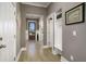 Well-lit entryway with wood floors, coat rack, and a view of the front door at 624 Sienna Way, Summerville, SC 29486