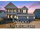 Charming two-story home featuring a welcoming porch, three-car garage, and a $10,000 buyer credit at 624 Sienna Way, Summerville, SC 29486