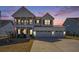 Charming two-story home featuring a welcoming porch and a convenient three-car garage at 624 Sienna Way, Summerville, SC 29486