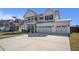 Beautiful two-story home featuring a welcoming porch and a convenient three-car garage at 624 Sienna Way, Summerville, SC 29486