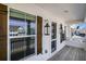 View of the front porch with decorative lanterns, stylish shutters, and a glimpse of the neighborhood at 624 Sienna Way, Summerville, SC 29486
