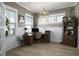 Comfortable home office with natural light, hardwood floors, and stylish light fixtures at 624 Sienna Way, Summerville, SC 29486
