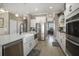 Well-equipped kitchen with island, stainless steel appliances, and modern finishes at 624 Sienna Way, Summerville, SC 29486