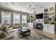 Bright living room with built-in shelving, fireplace, and cozy furnishings at 624 Sienna Way, Summerville, SC 29486