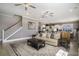 Cozy living room showcasing an open floor plan with a staircase and modern kitchen at 624 Sienna Way, Summerville, SC 29486