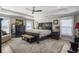 Relaxing main bedroom with tray ceilings, neutral decor, and a ceiling fan at 624 Sienna Way, Summerville, SC 29486