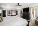 Large main bedroom with a ceiling fan, ensuite bathroom, and neutral color palette at 624 Sienna Way, Summerville, SC 29486