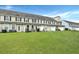 A large grassy area and the back of the building at 711 Hemingway Cir, Summerville, SC 29483