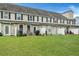 Spacious backyard with green lawn and a patio area, perfect for outdoor entertaining and relaxation at 711 Hemingway Cir, Summerville, SC 29483