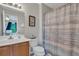 Upstairs bathroom with wood cabinets and shower and tub combination at 711 Hemingway Cir, Summerville, SC 29483