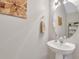 Pedestal sink in bathroom with towel ring, wall art, and decorative mirror at 711 Hemingway Cir, Summerville, SC 29483