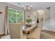 Inviting dining area featuring a large window with natural light, stylish decor, and open floor plan at 711 Hemingway Cir, Summerville, SC 29483