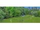 Community dog park featuring a fenced-in area with shade canopies and well-maintained lawn at 711 Hemingway Cir, Summerville, SC 29483