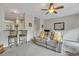 Comfortable living room with ceiling fan, view of kitchen bar, plus comfortable seating at 711 Hemingway Cir, Summerville, SC 29483