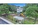 Playground with swings, a slide, and a pergola, providing a fun and safe environment at 711 Hemingway Cir, Summerville, SC 29483