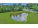 Scenic pond with a fountain and manicured lawn, creating a peaceful outdoor space at 711 Hemingway Cir, Summerville, SC 29483
