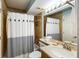 Full bathroom with shower/tub combo, vanity with sink, and tiled walls at 7600 Palmetto Drive # D-222, Isle of Palms, SC 29451
