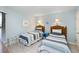 Comfortable bedroom with two twin beds, ocean-themed decor, and a large window with blinds at 7600 Palmetto Drive # D-222, Isle of Palms, SC 29451