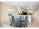 Eat-in dining room adjacent to the kitchen featuring seating for six and modern chandelier at 7600 Palmetto Drive # D-222, Isle of Palms, SC 29451