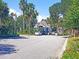 Charming gated community entrance with lush landscaping and coastal charm on a clear, sunny day at 7600 Palmetto Drive # D-222, Isle of Palms, SC 29451
