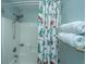 Shower with a gnome-themed shower curtain and white towels at 7977 Shadow Oak Dr, North Charleston, SC 29406