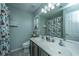 Bathroom featuring double sinks and a gnome-themed shower curtain at 7977 Shadow Oak Dr, North Charleston, SC 29406