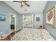 Bedroom with wood floors, large window and ensuite bathroom at 7977 Shadow Oak Dr, North Charleston, SC 29406
